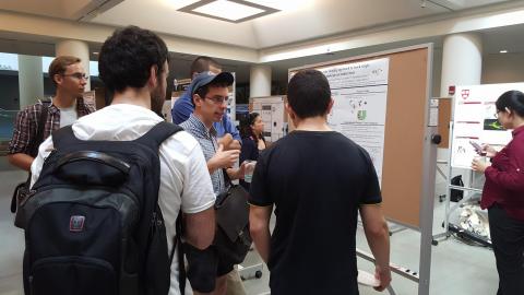 Physics/PEB student presenting his Integrated Workshop project on the optimization of a microfluidic device used to single-cell trapping at the 2016 iPoLS meeting..