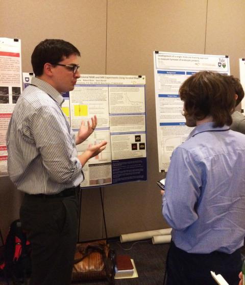 2015 meeting: Physics graduate student presenting his research.